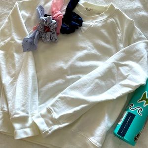 Brandy Melville white crewneck sweater.